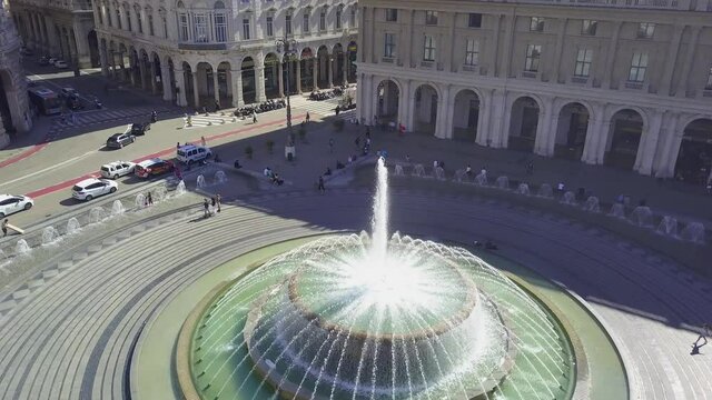 Aerial panoramic drone view of Fountain in the main square of the city Piazza De Ferrari in Genoa,Italy. Situated in the heart of the city between the historical and the modern center. 4K video