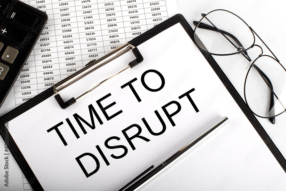 Poster paper with text time to disrupt on table on the chart