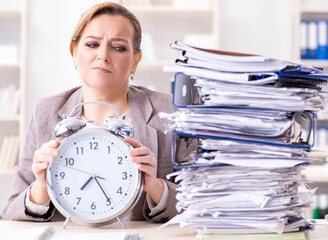 Businesswoman workaholic trying to finish urgent paperwork
