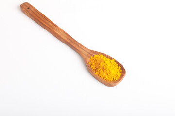 Turmeric in wooden spoon on white background.