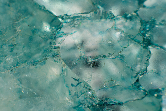 Macro photograph of light blue mineral crystal structure, extreme close-up of geological rock formation with translucent crystalline textures