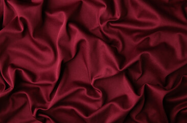 Smooth elegant burgundy silk or satin luxury cloth texture can use as abstract background....