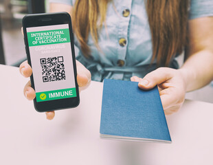 The woman showing digital health passport app in mobile phone and gives passport