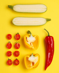 Different vegetables on bright backgrounds. Cucumbers, zucchini, carrots, avocado, peppers, cherry tomatoes