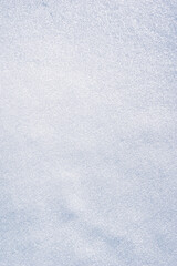 textured vertical photo of ground with smoothed white snow