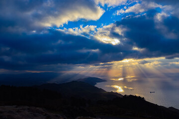 Sea view with rays coming through clouds