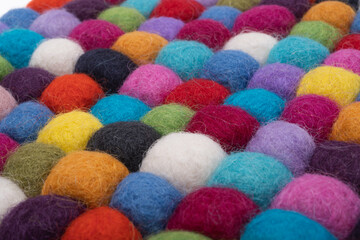 colored balls made of felt close-up