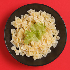 Italian spaghetti. Raw pasta. Cooked pasta. Pasta on bright backgrounds with vegetables
