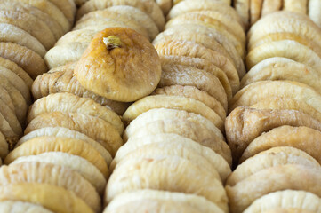 dried figs are laid out in rows as a background