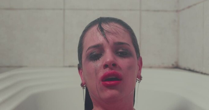 The abused girl comes out of the bathroom in despair