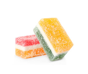 Delicious sweet marmalade pieces on white background