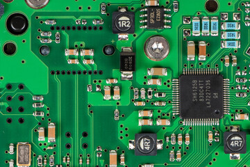 Electronics. Back of a traditional HDD details macro closeup chips resistors capacitors and other...