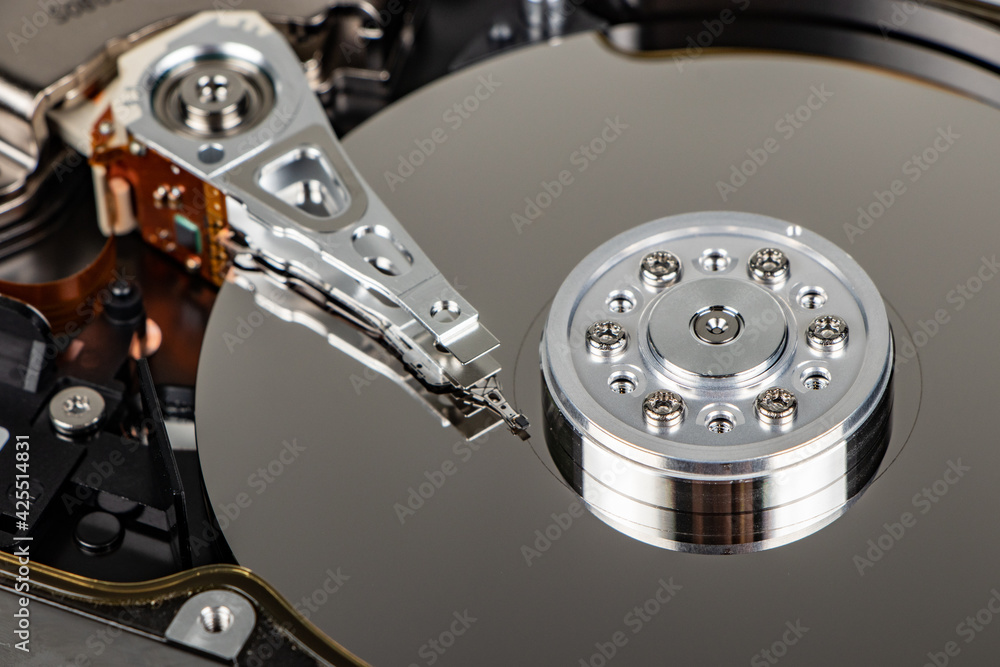 Poster disassembled hard drive from the computer, hdd with mirror effect. opened hard drive from the comput