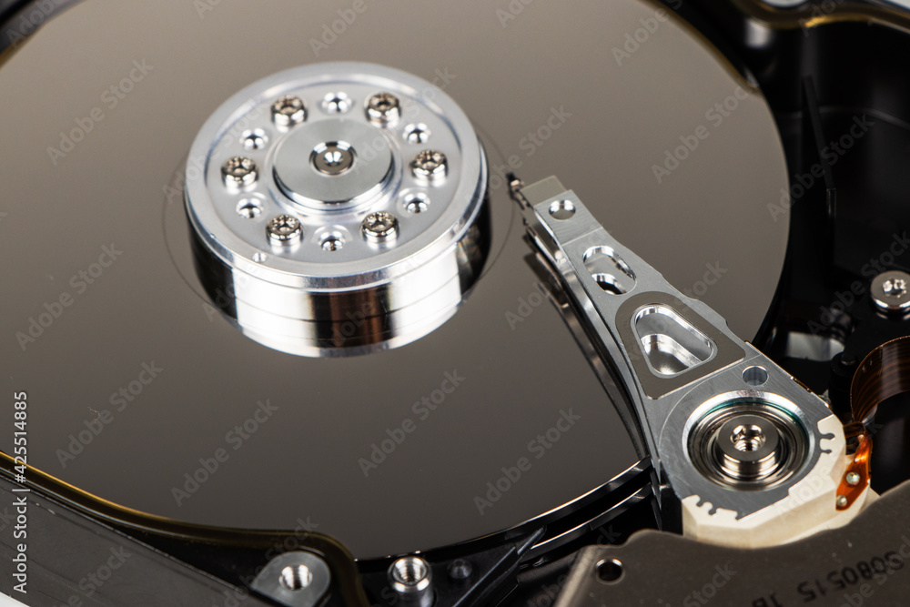 Poster disassembled hard drive from the computer, hdd with mirror effect. opened hard drive from the comput