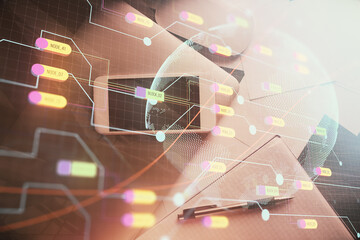 Double exposure of map hologram drawing over desktop. Top view. International connection concept.