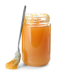 Jar of delicious orange marmalade with spoon on white background