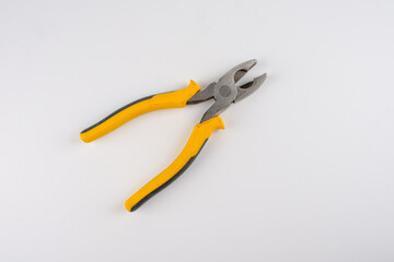 Obraz premium yellow pliers isolated on white background