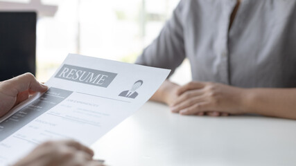 Employer or HR department is reading the resume and interviewing the ability of new employees, Employer is selecting job applicants, Employment and Recruitment Concept.