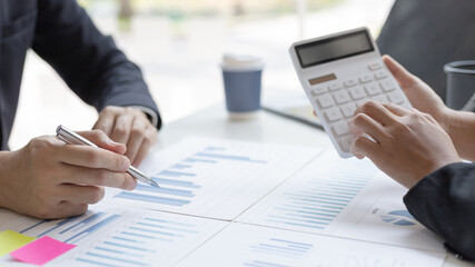 Brainstorm team, Marketers and financial accountants are discussing and analyzing charts to plan strategies to meet customer needs, Computer technology for business concept.