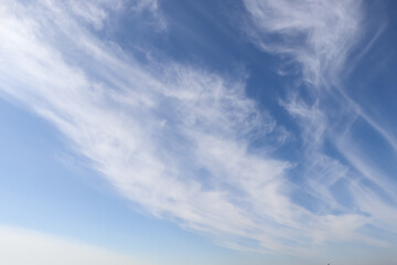Beautiful fluffy white clouds in blue sky