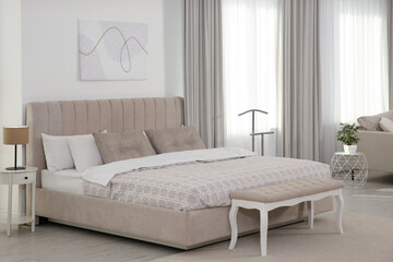 Stylish hotel bedroom interior with modern furniture