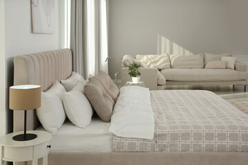 Stylish hotel bedroom interior with modern furniture