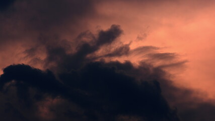 Fototapeta premium Time lapse of epic sunrise rising above clouds with fiery glow, burning red sun
