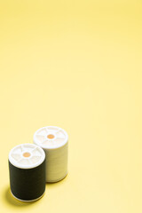 Black and white sewing thread. Vertical view and copy space wallpaper.