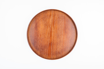 A round wooden tray on white background