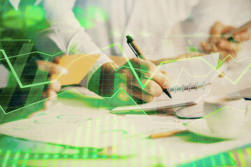 Double exposure of forex graph drawing over people taking notes background. Concept of financial...