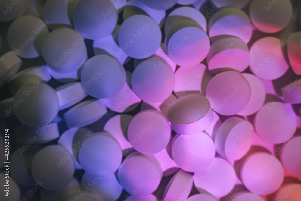 Poster pills or drugs in a package under neon light. beautiful background pattern for design.