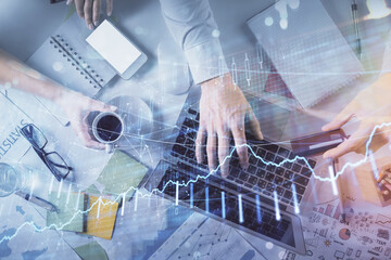 Double exposure of man and woman working together and forex graph hologram drawing. Financial analysis concept. Computer background. Top View.