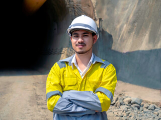 Young Asian tunnel engineering working at construction site.