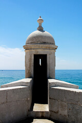 Watchtower of the fortress on the beach in Sesimbra village