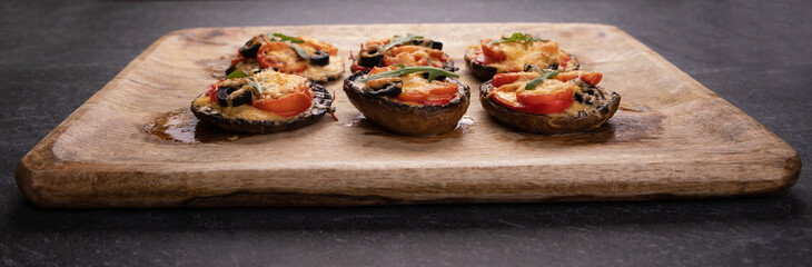 pizza portobello mushrooms on wooden tray, proper nutrition concept, panoramic image