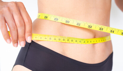 Waist tape with woman. slim fit lady measuring her waist on white background. for weight loss, diet...