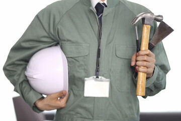 Cropped image of engineer holding working tools