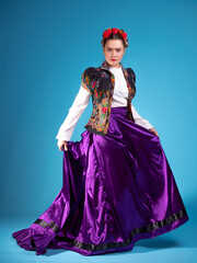 A young woman in an ethnic outfit, Spanish or Mexican style,