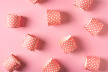Cupcake paper form pattern on pink background