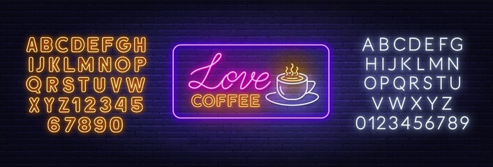 Naklejka premium Love coffee neon sign on brick wall background.