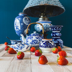 Traditional Dutch Blue patterned objects with fresh traditional Dutch food-strawberries, on the...