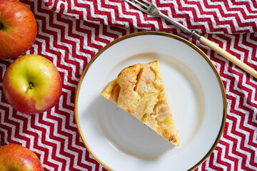 Plate with piece of tasty homemade apple pie on white background 