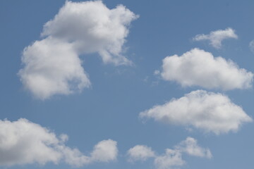 There are clouds in the sky. The blue sky is covered with clouds. Cloudy. Clouds in the sky. 