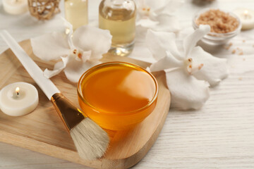 Cosmetic product for spa body wraps on white wooden background