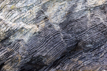 Granite cliff has many shades(black, grey, white), it is a beautiful natural theme.