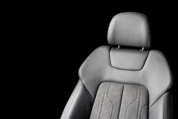 Modern luxury car black leather with alcantara interior. Part of black leather car seat details...