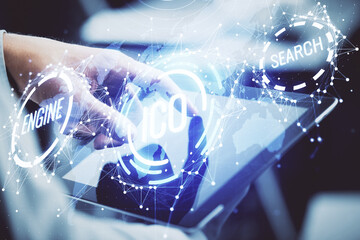 Double exposure of man's hands holding and using a phone and crypto currency blockchain theme drawing.