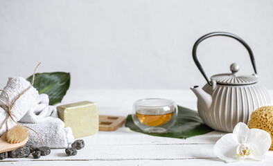Spa composition with bath accessories and tea copy space.