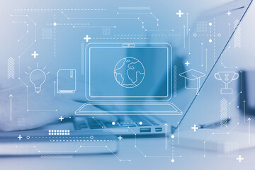 Notebook icon with a globe inside, laptop with hands in the background, worldwide education and business concept. Double exposure