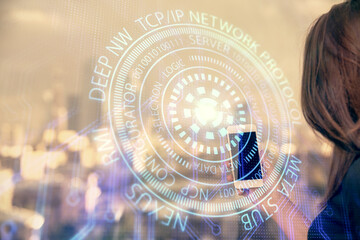 Fototapeta premium Double exposure of technology sketch hologram and woman holding and using a mobile device.